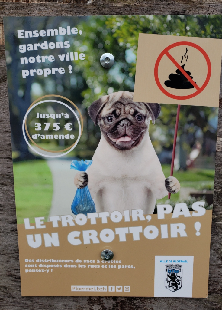 Ploërmel, France public notice sign warning of a fine for not picking up your dog's poop